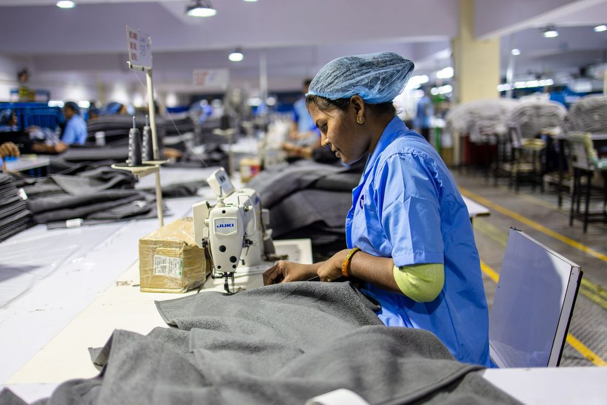 Indian textile worker at a sewing machine